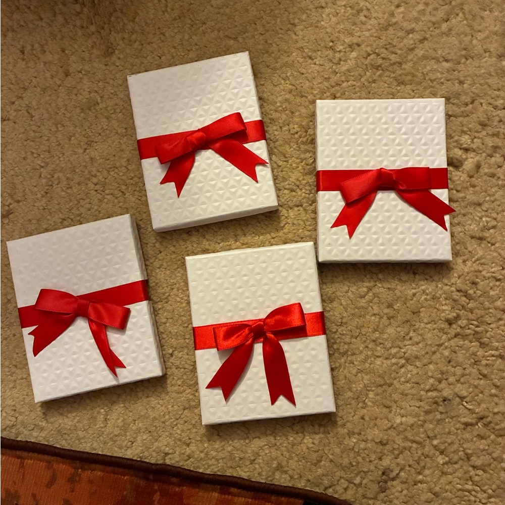 White Gift Boxes with Red Bows